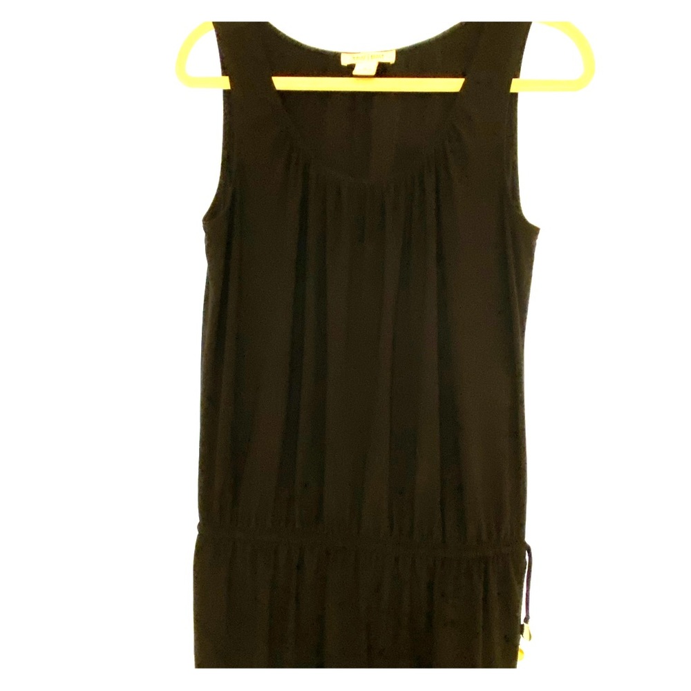 Black sleeveless top.